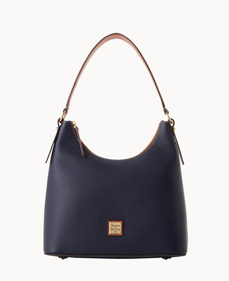 A navy blue leather hobo handbag with a single tan handle, gold-tone hardware, and a small square Dooney & Bourke logo patch on the front. The bag has a simple, elegant design and textured surface.