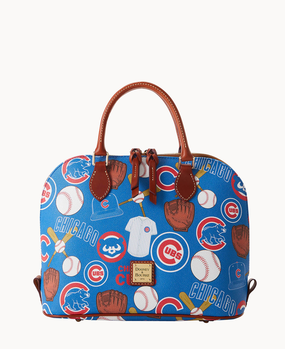 A blue handbag with brown handles featuring a Chicago Cubs baseball-themed pattern, including logos, baseballs, gloves, bats, and the word Chicago. The bag has a Dooney & Bourke label on the front.