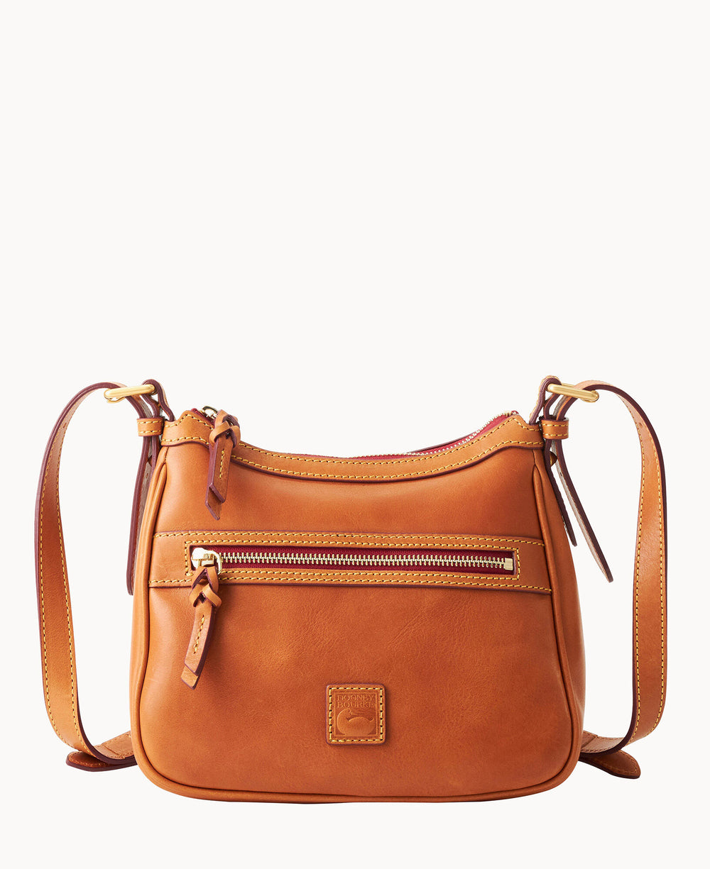A medium-sized tan leather crossbody bag with a front zipper pocket, a small logo patch, and adjustable shoulder strap. The bag has gold-tone hardware and visible stitching details.