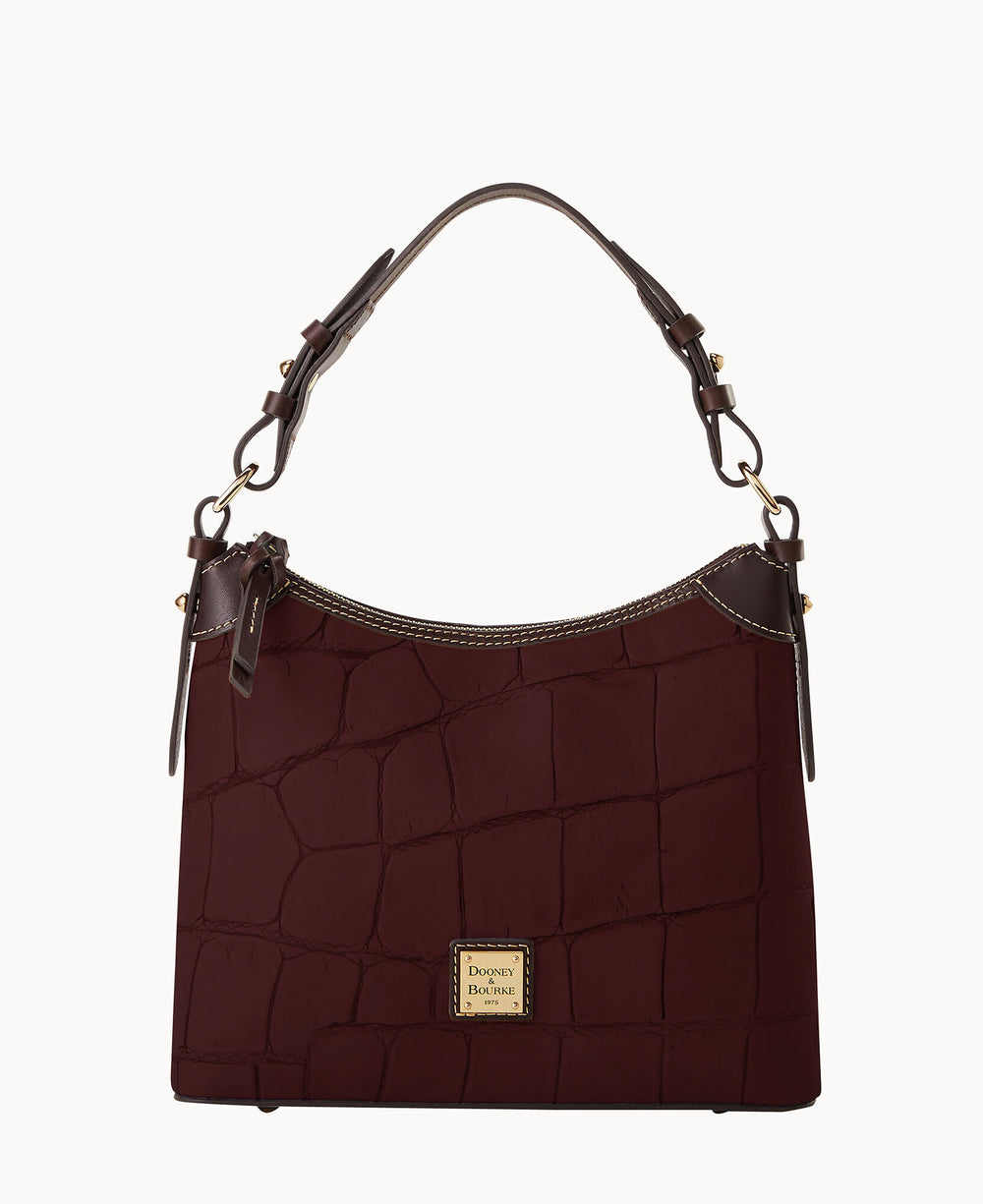 A dark brown crocodile-embossed leather handbag with a short, adjustable handle and gold hardware, featuring a Dooney & Bourke logo plate on the front.