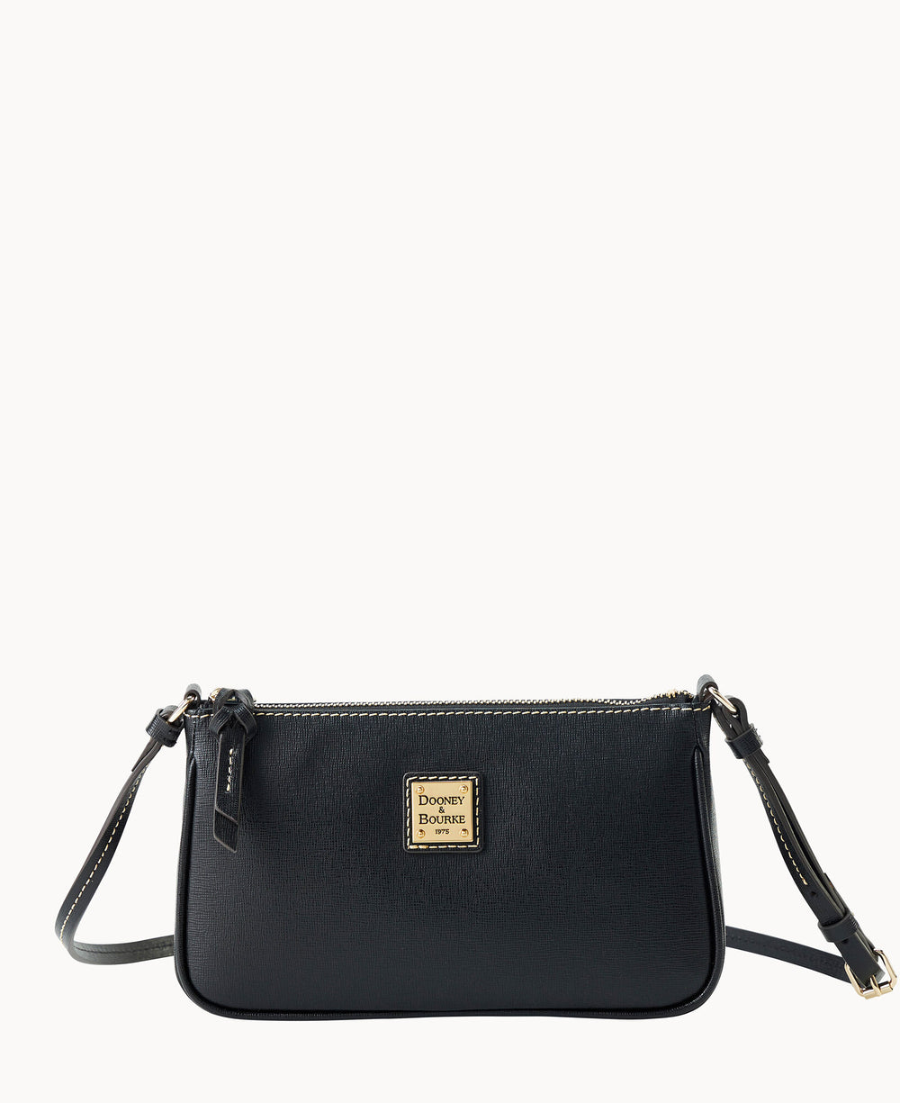 A small black leather Dooney & Bourke crossbody bag with a gold logo plate, zipper closure, and adjustable strap, photographed against a plain white background.