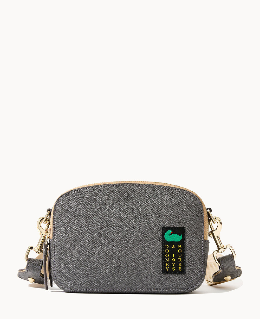 A small, rectangular gray crossbody bag with gold hardware, beige trim, and a detachable strap. The front features a green duck logo and yellow Dooney & Bourke 1975 text.