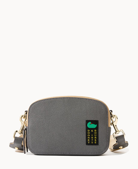 A small, rectangular gray crossbody bag with gold hardware, beige trim, and a detachable strap. The front features a green duck logo and yellow Dooney & Bourke 1975 text.