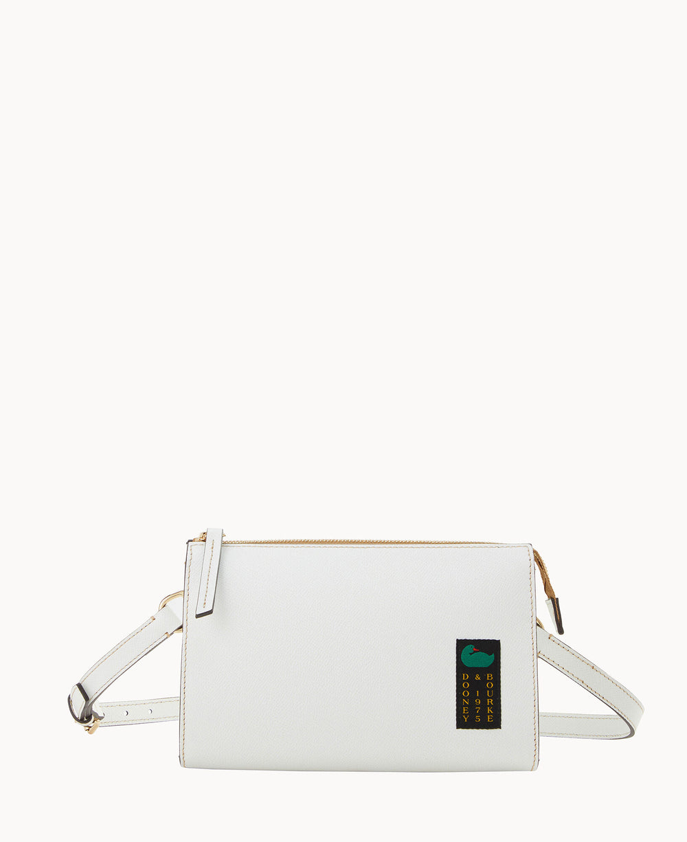 A rectangular white crossbody bag with a zip closure, adjustable strap, and a small black patch featuring gold text and a green graphic on the lower right corner. The background is plain white.