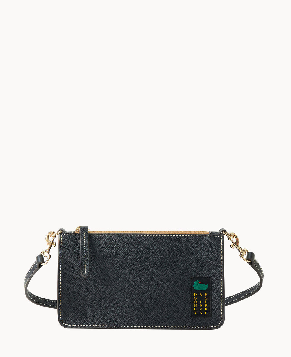 A rectangular black leather crossbody bag with gold hardware, a detachable strap, and a small green and yellow logo patch in the bottom right corner. The background is plain white.