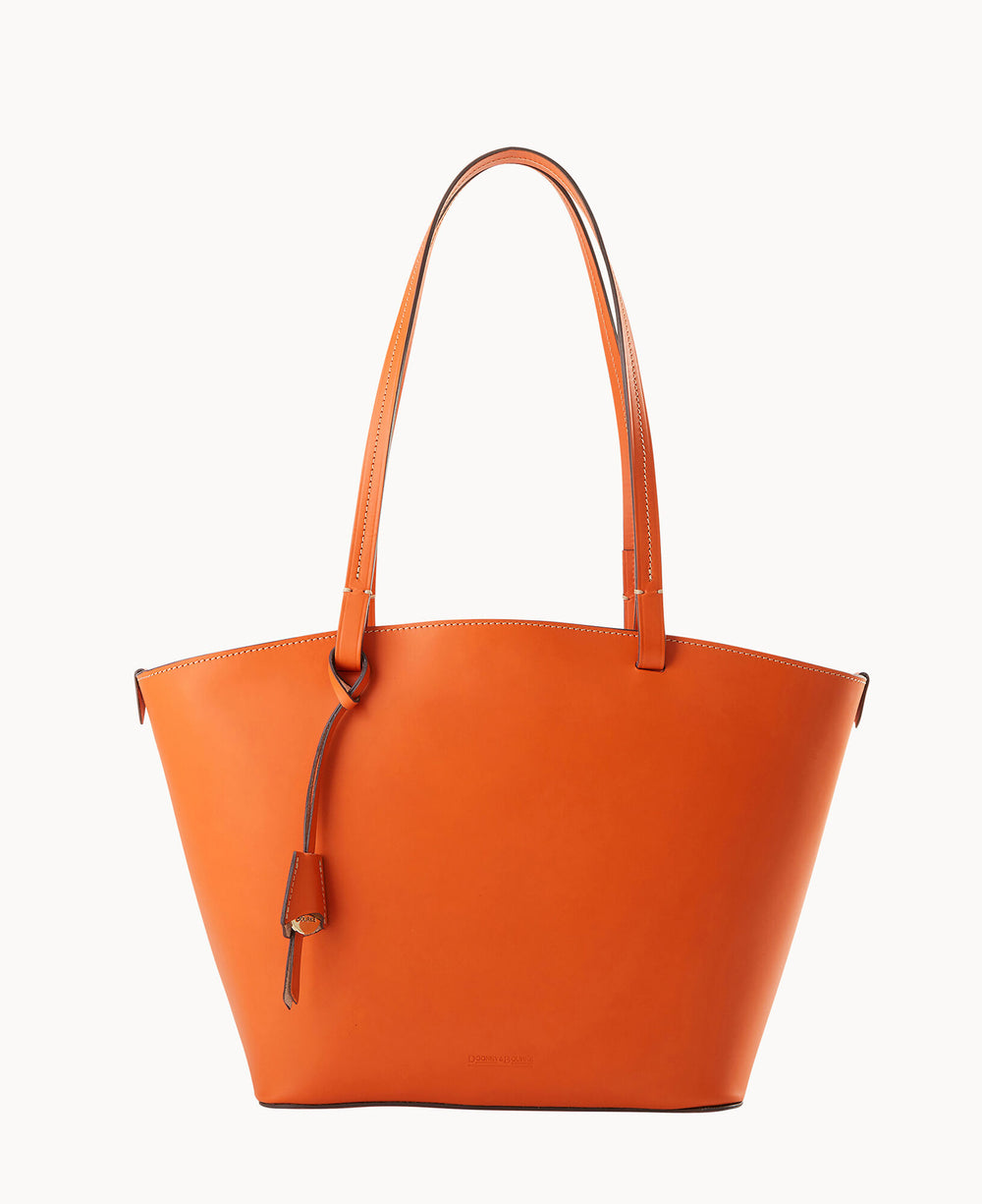 A large orange leather tote bag with two shoulder straps and a small attached leather tag, displayed against a plain white background.