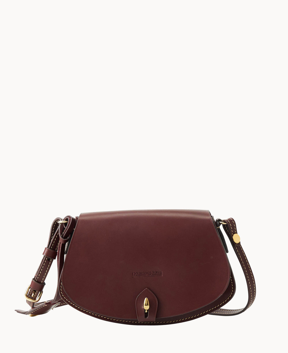A burgundy leather crossbody bag with a rounded flap, gold-tone buckle detail, adjustable strap, and white stitching accents. The bag is displayed on a plain white background.