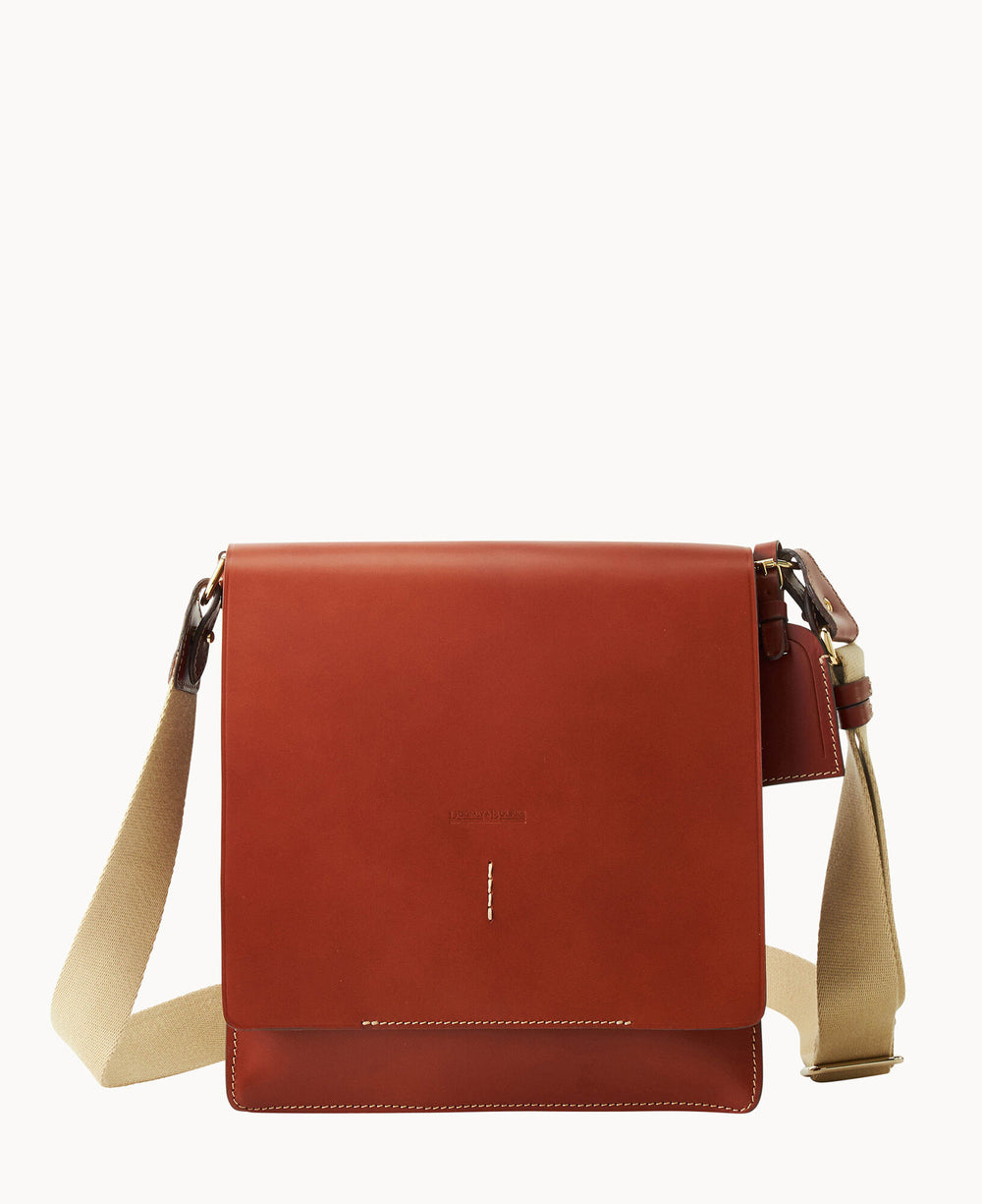 A brown leather messenger bag with a flap closure and beige adjustable shoulder strap, displayed against a plain white background.