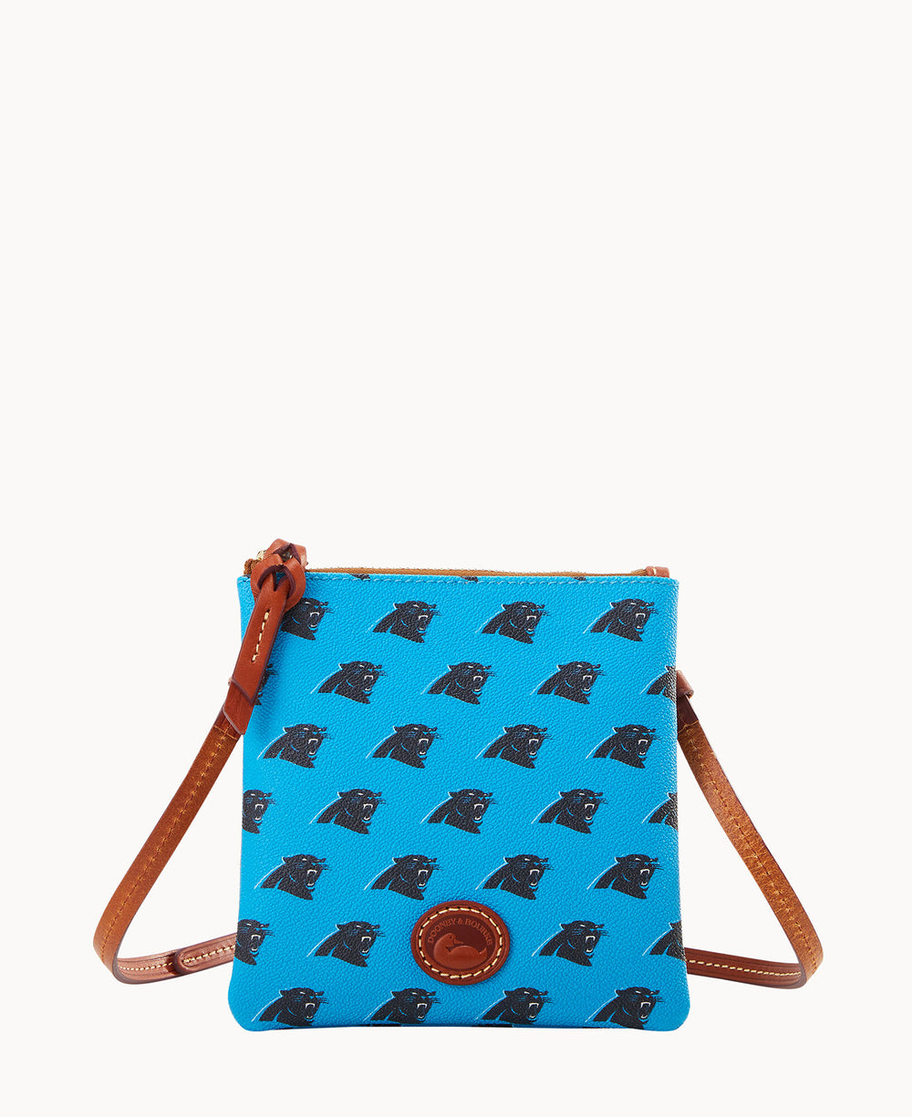 A small, blue crossbody bag with brown leather straps, featuring a repeating black panther head logo pattern and a round brown leather emblem on the front.