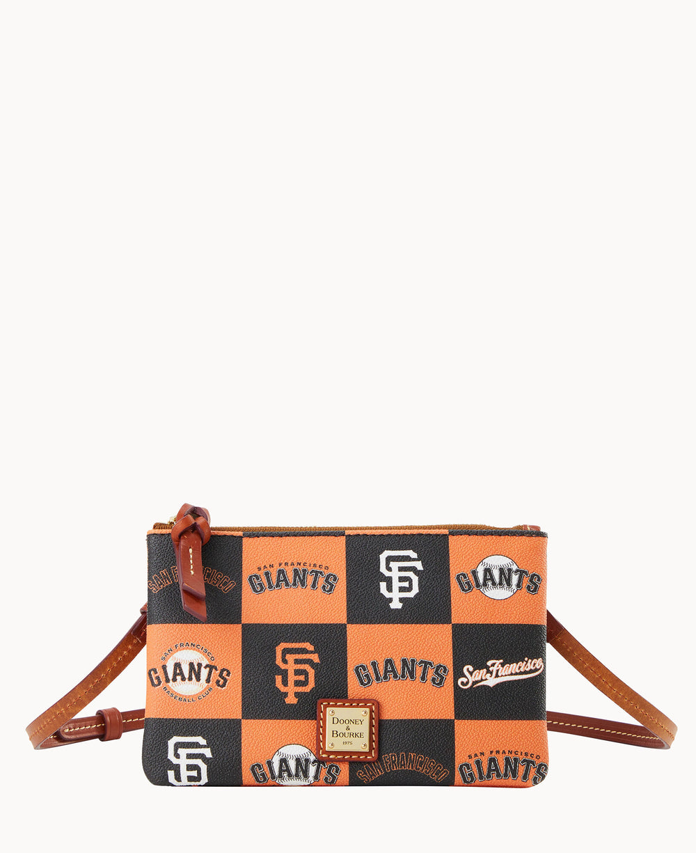 A small crossbody bag with an orange and black checkered pattern featuring San Francisco Giants logos and text. The bag has a brown strap, zipper, and a Dooney & Bourke label on the front.