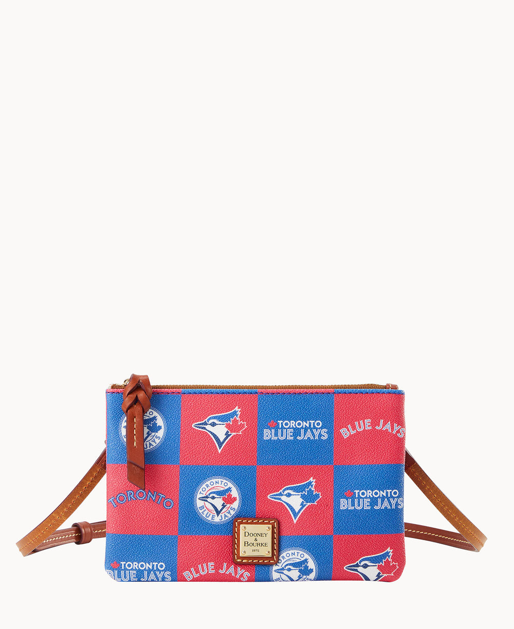 A small crossbody bag with brown leather straps, featuring a red and blue checkerboard pattern with Toronto Blue Jays logos and text. The front has a leather Dooney & Bourke logo patch.