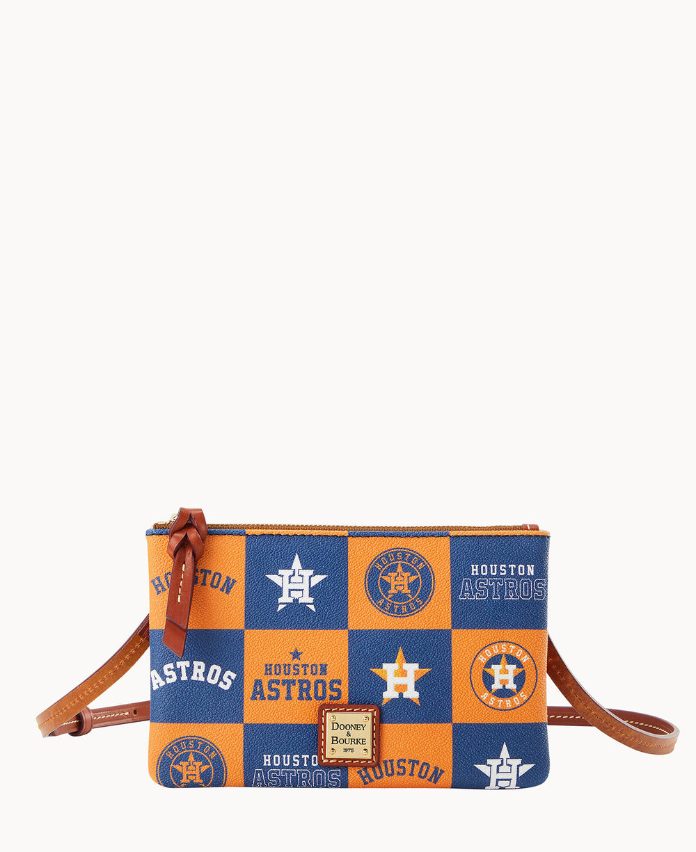 A rectangular crossbody bag with a brown strap, featuring a blue and orange checkered pattern with â€œHouston Astrosâ€ text and team logos. The Dooney & Bourke logo is on the front.
