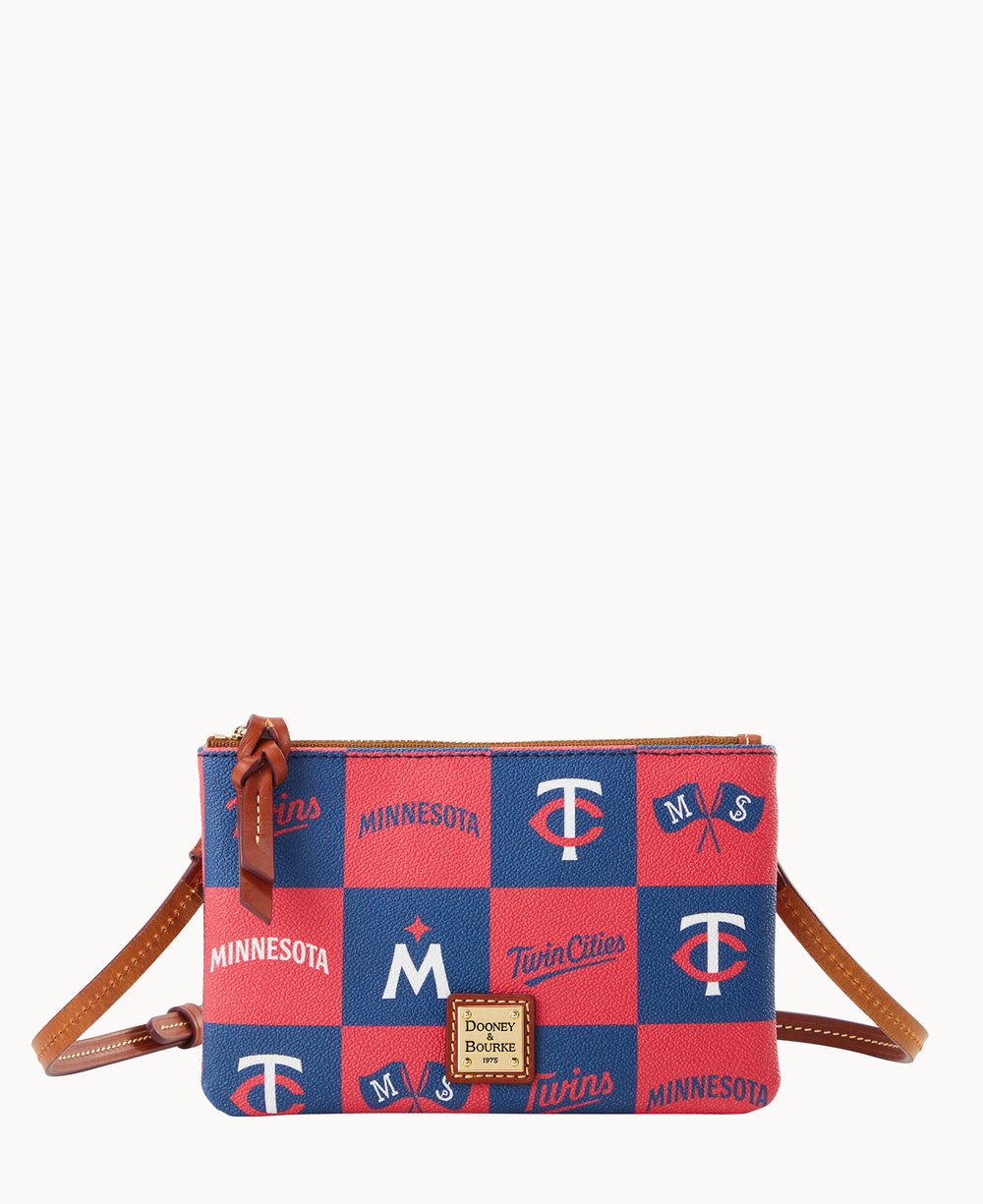A small crossbody bag with a red and blue checkerboard pattern featuring Minnesota Twins logos and text. The bag has a brown leather strap, zipper, and a gold Dooney & Bourke label on the front.