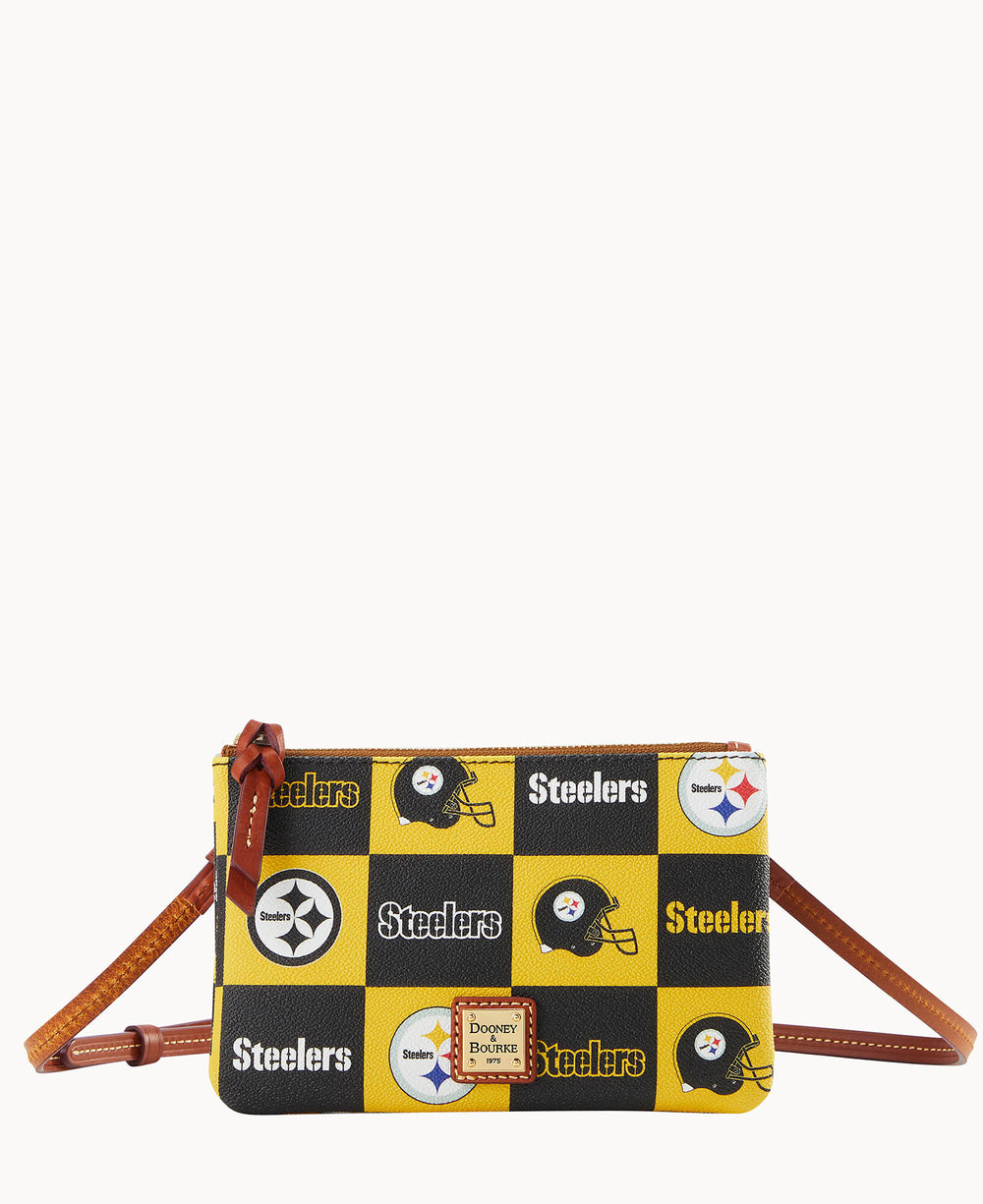 A small crossbody bag with a brown strap, featuring a yellow, black, and white checkered pattern with Pittsburgh Steelers logos and Steelers text. The Dooney & Bourke logo is on a tan patch at the front.