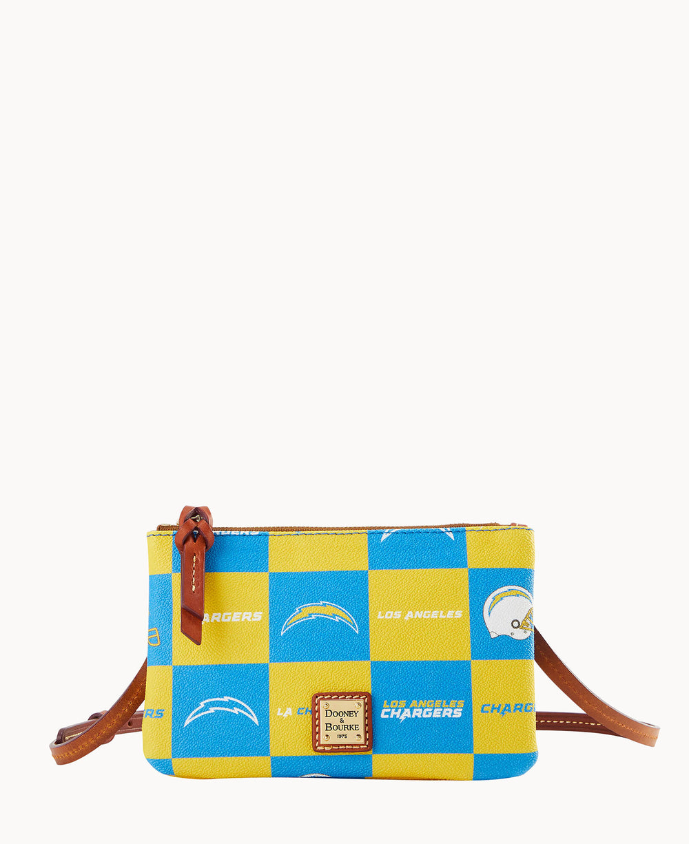 A small crossbody bag features a blue and yellow checkered pattern with Los Angeles Chargers logos and text, a brown leather strap and zipper pull, and a gold Dooney & Bourke label on the front.