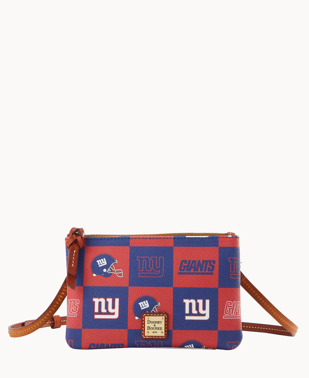 A small crossbody bag with a red and blue checkered pattern featuring New York Giants logos and helmets, brown leather trim, and a gold Dooney & Bourke label on the front.