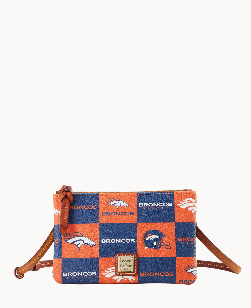 A small crossbody bag featuring a blue and orange checkered pattern with Denver Broncos logos and text, brown leather strap and zipper, and a Dooney & Bourke label on the front.