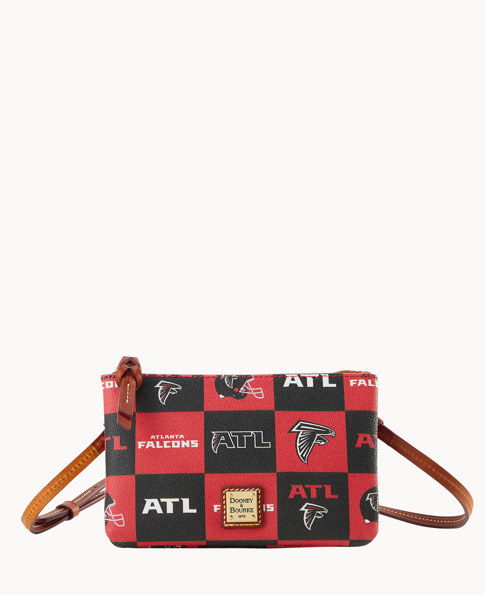 A small crossbody bag with a red and black checkered pattern featuring the Atlanta Falcons logo, ATL, and Atlanta Falcons text, brown leather strap and accents, and a Dooney & Bourke label on the front.