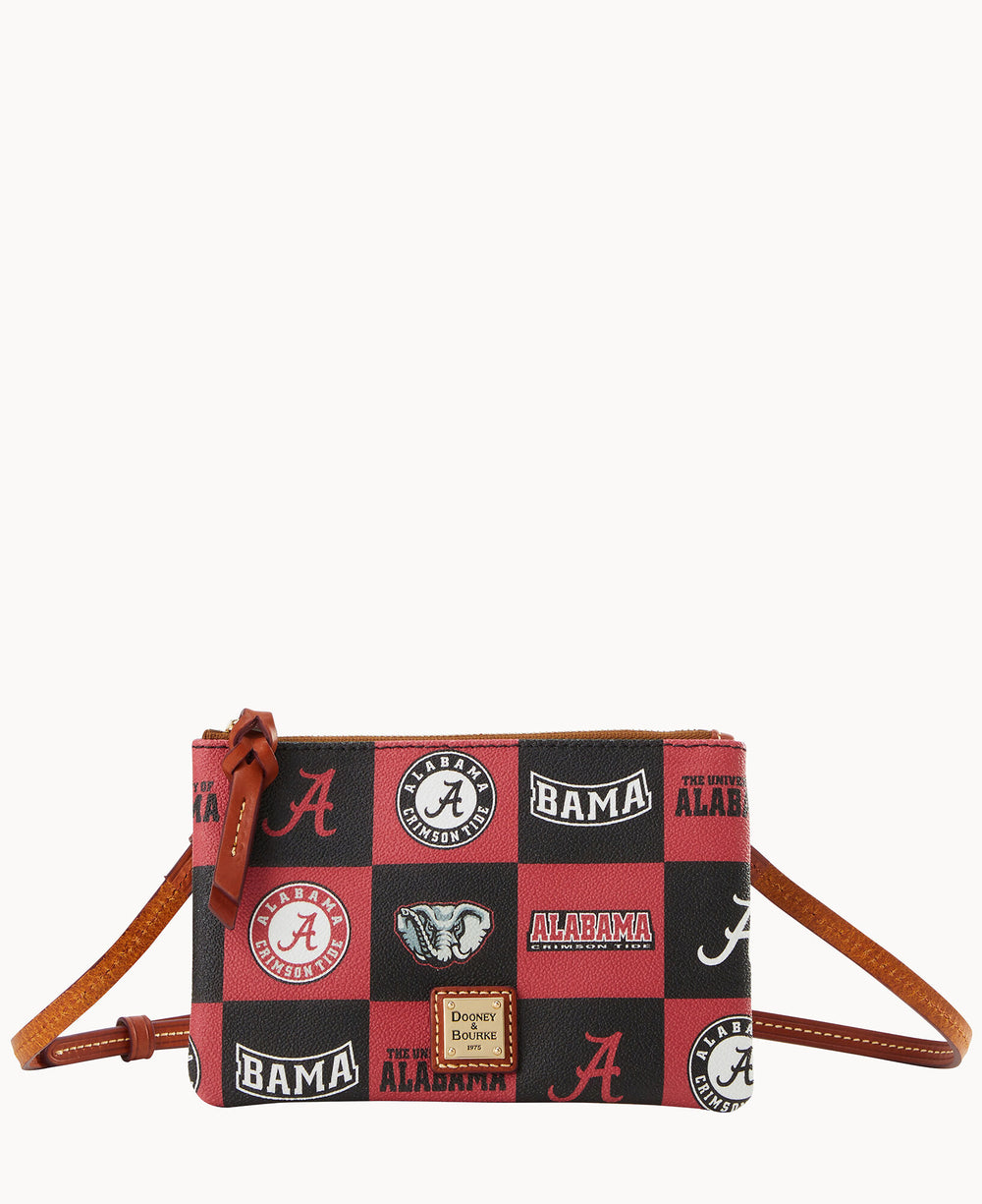 A small crossbody bag with brown leather strap and trim, featuring a black and red checkered pattern with University of Alabama logos, â€œBAMAâ€ text, elephant mascots, and a Dooney & Bourke label on the front.