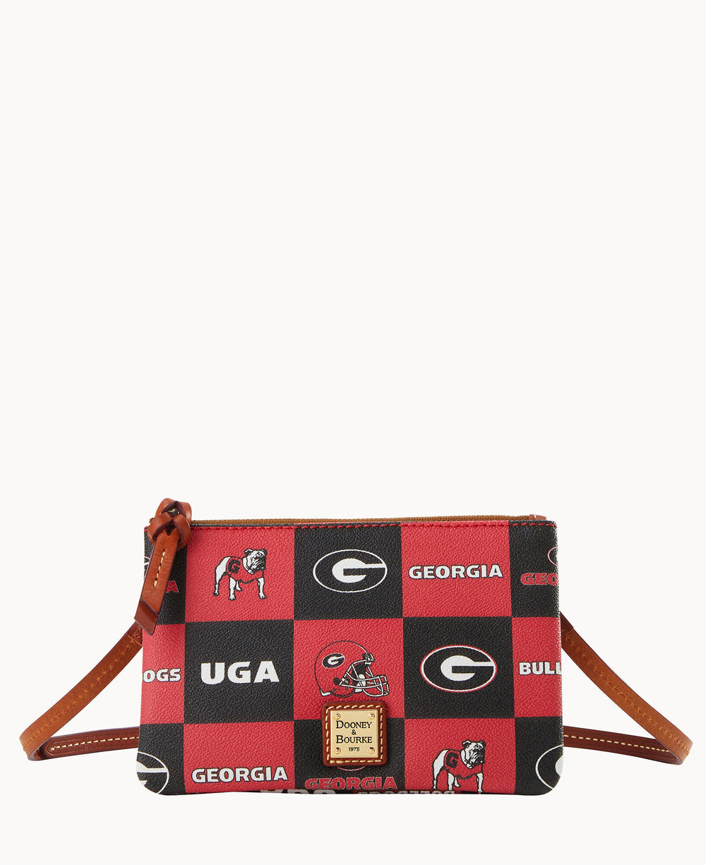 A small Dooney & Bourke wristlet bag with a red and black checkerboard pattern featuring University of Georgia logos, bulldog mascots, and UGA, GEORGIA, and BULLDOGS text.