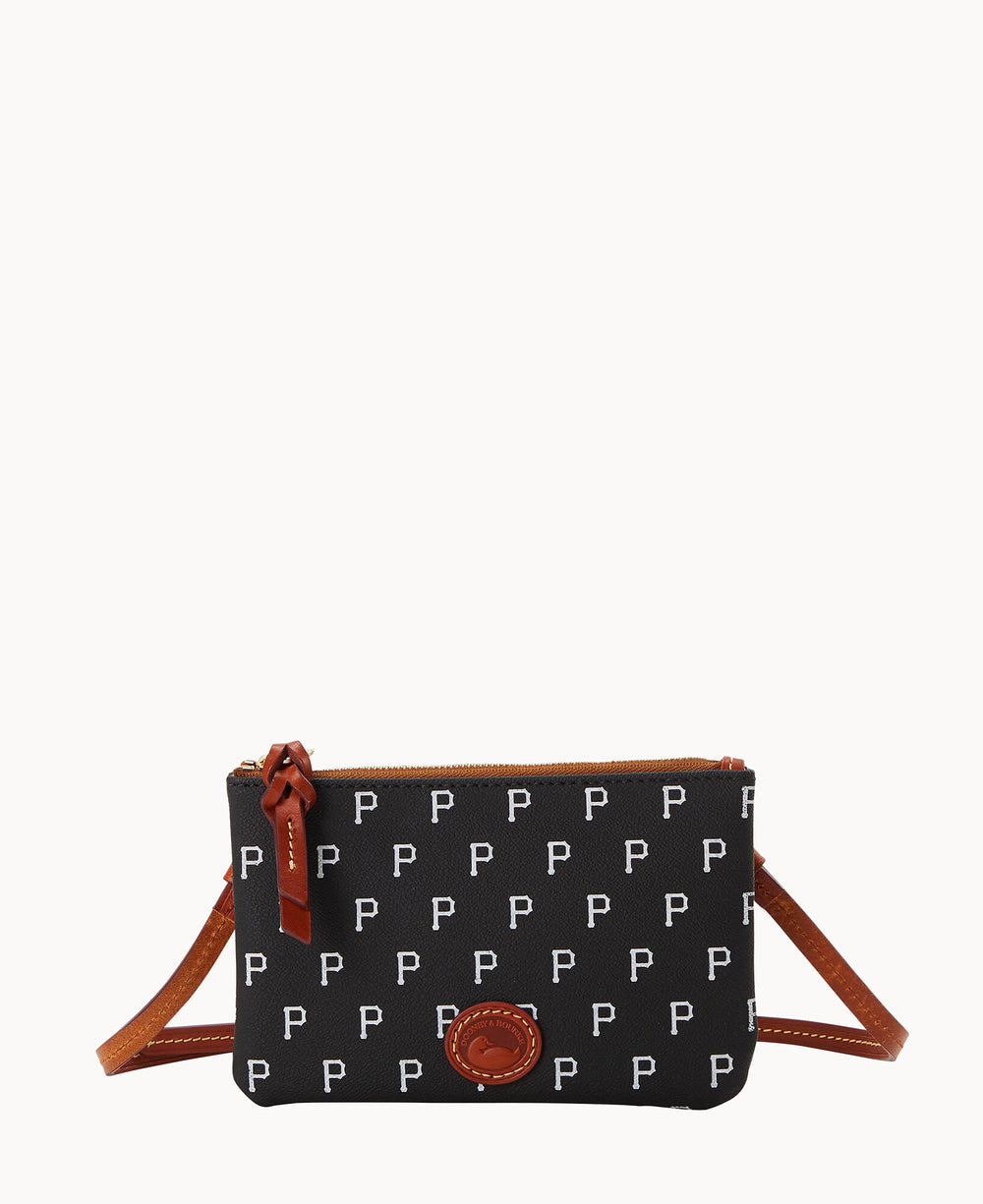 A small black crossbody bag with a repeating white letter P pattern, brown leather strap, zipper pull, and a round brown leather patch on the front.