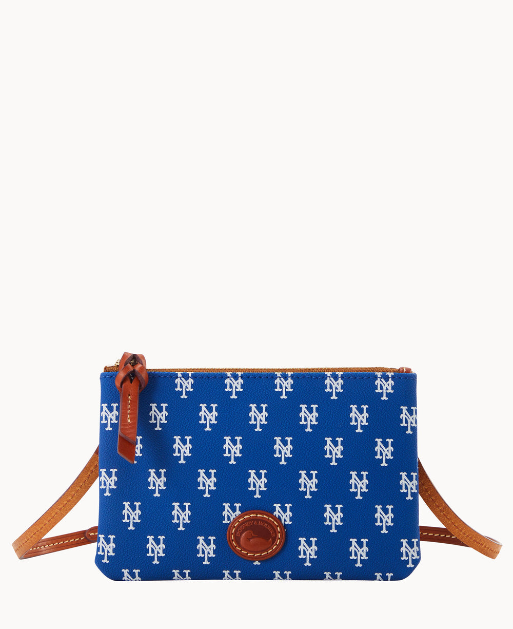 A blue crossbody bag with brown leather accents, featuring an all-over white New York Mets NY logo pattern and a zippered top.
