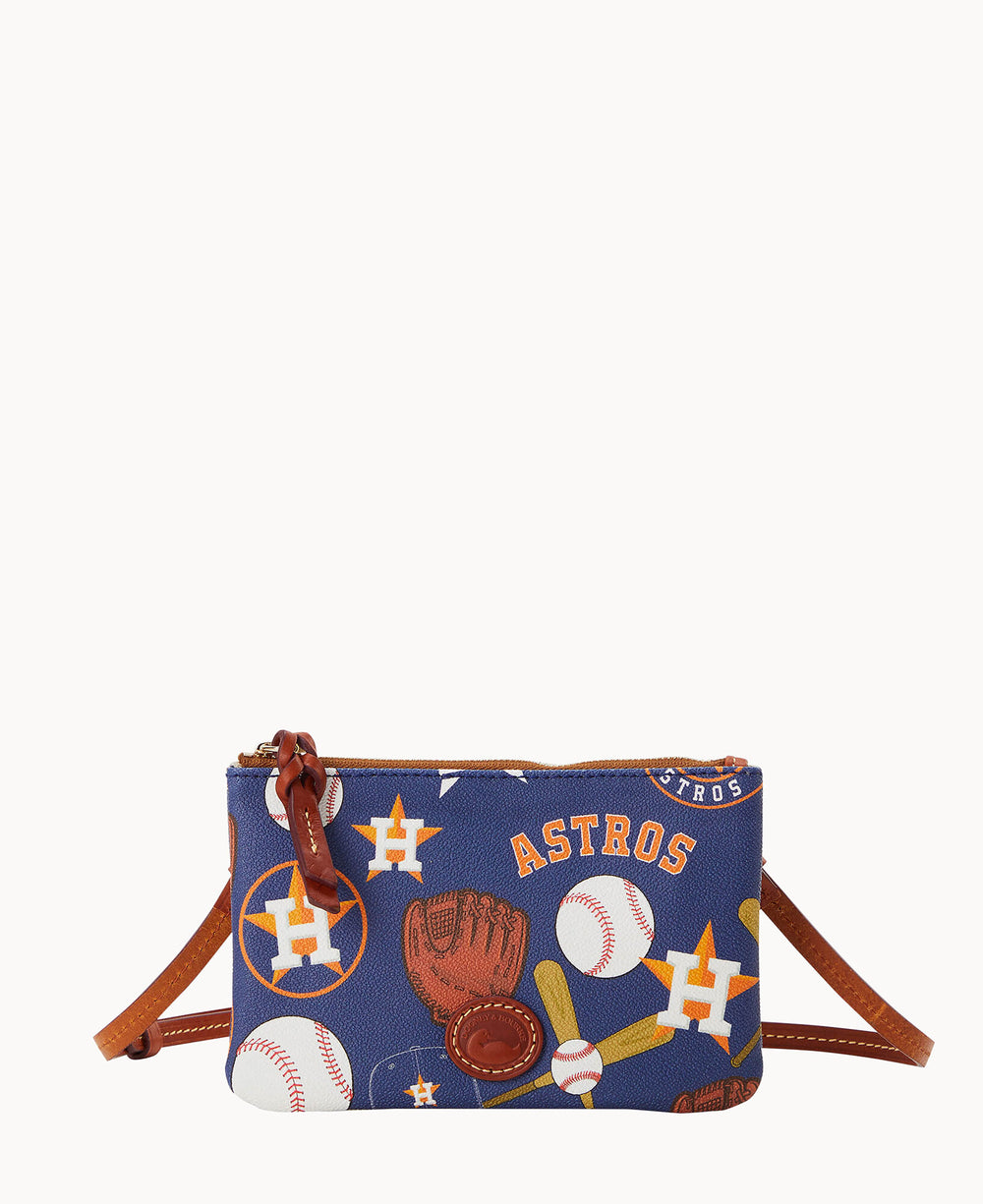 A small blue crossbody bag decorated with Houston Astros logos, baseballs, bats, gloves, and stars, featuring brown leather accents and a zip closure.