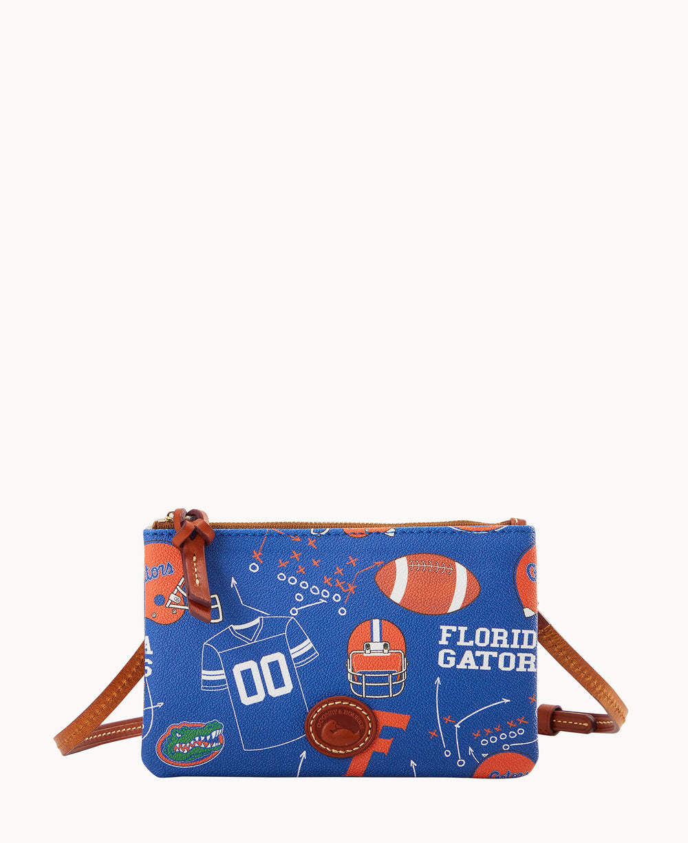 A blue crossbody bag with brown accents, featuring Florida Gators-themed graphics including a football helmet, football, jersey, team name, alligator logo, and play diagrams.