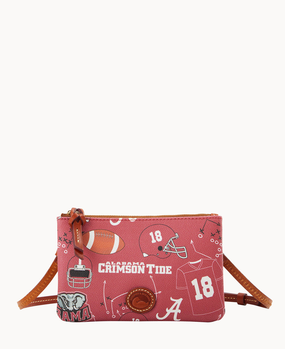 A small pink crossbody bag with brown leather trim, featuring Alabama Crimson Tide football-themed graphics, including a football, jersey, team logo, elephant mascot, and play diagrams.