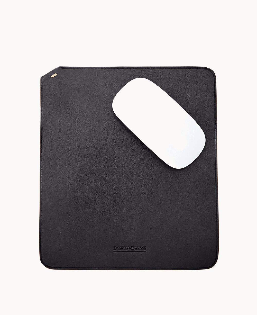 A black leather mouse pad with a white computer mouse placed diagonally on top, against a plain white background.