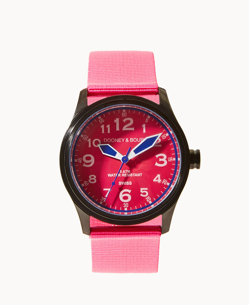 A wristwatch with a bright pink strap and matching pink face, featuring white numerals and hands. The watch is labeled Dooney & Bourke and Swiss with Water Resistant 5 ATM on the dial.
