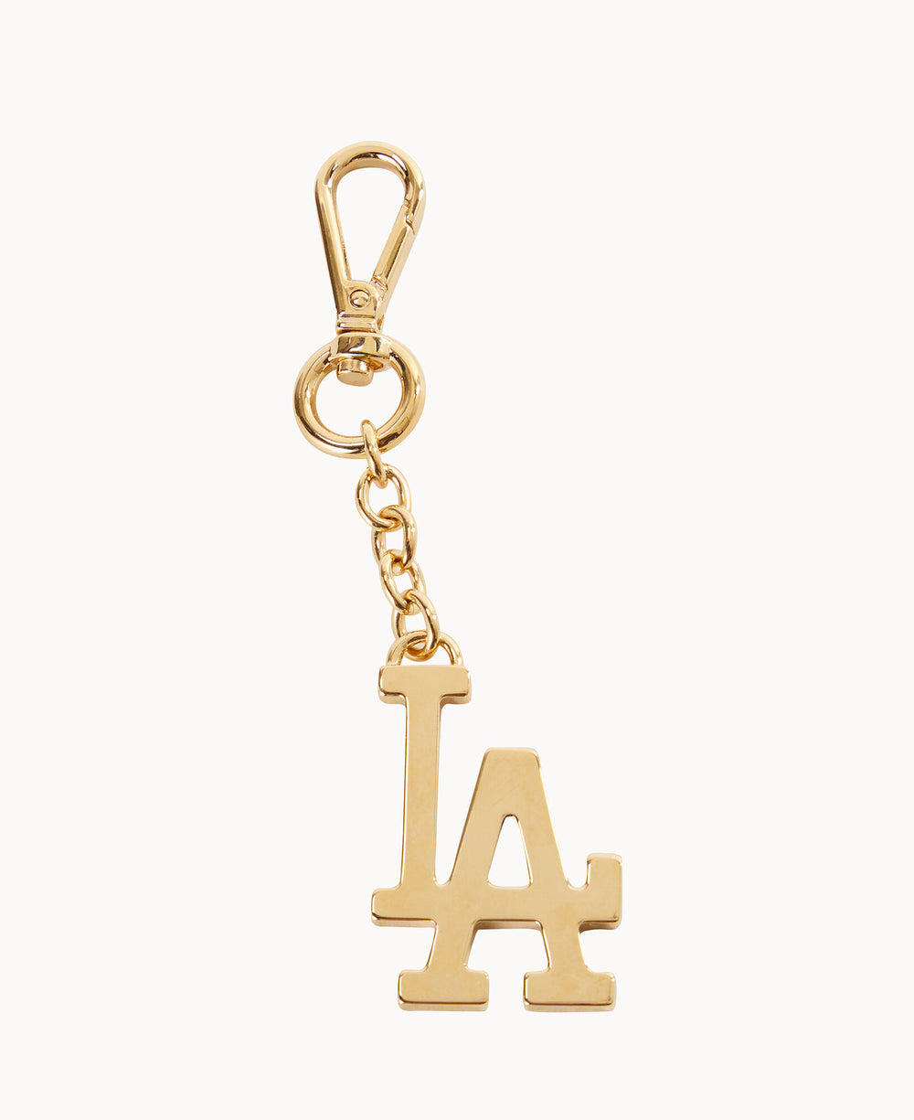 A gold keychain with a clasp, featuring a dangling charm shaped like the letters LA in a bold, uppercase font.