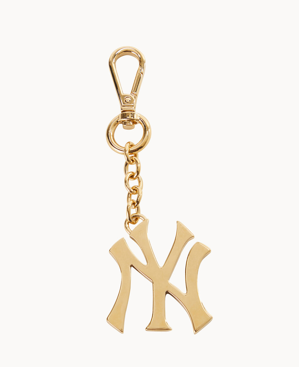 A gold keychain with a clasp, featuring a charm in the shape of the interlocking NY logo, commonly associated with the New York Yankees baseball team.