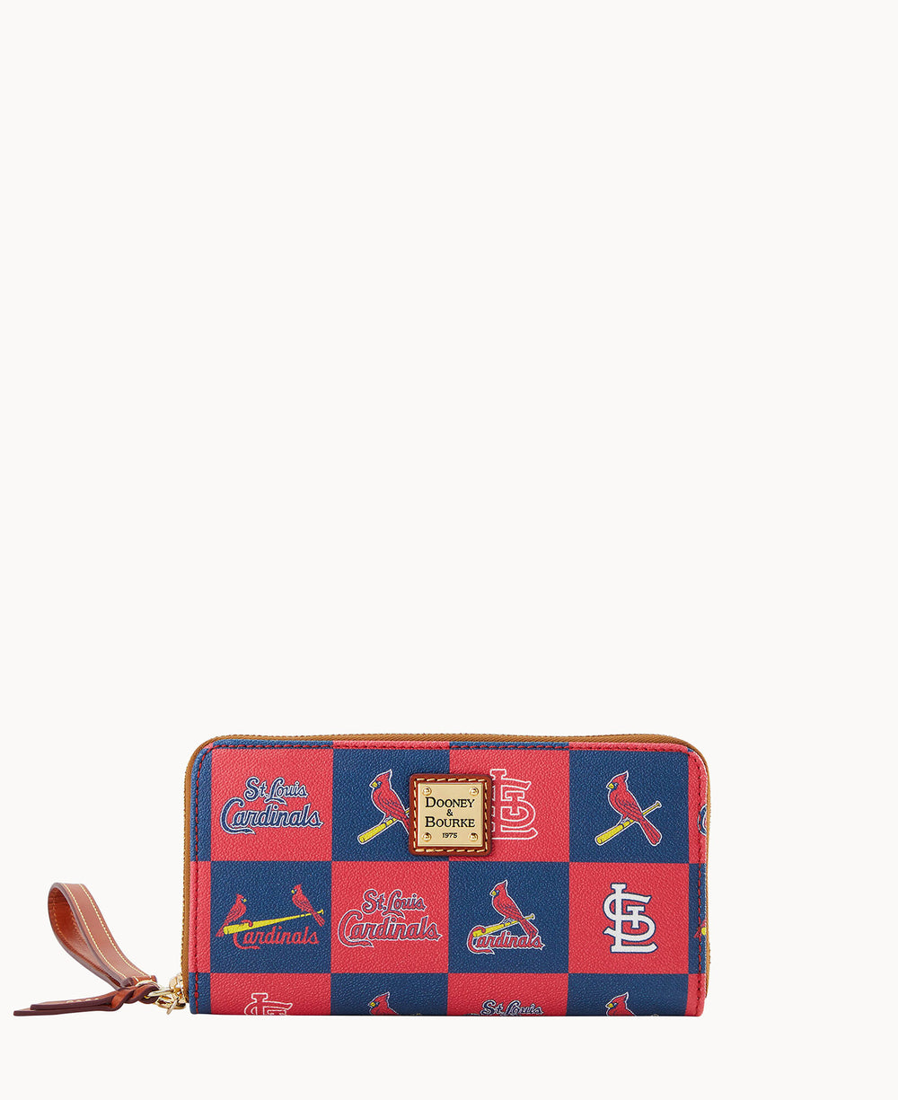 A rectangular zip-around wallet with a red and blue checkerboard pattern, featuring St. Louis Cardinals logos and text. A leather zipper pull and a Dooney & Bourke label are on the front.