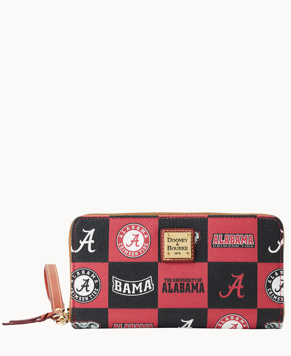 A zippered wallet with a brown leather strap, featuring a red, black, and white patchwork design of University of Alabama logos, including A, BAMA, and ALABAMA.