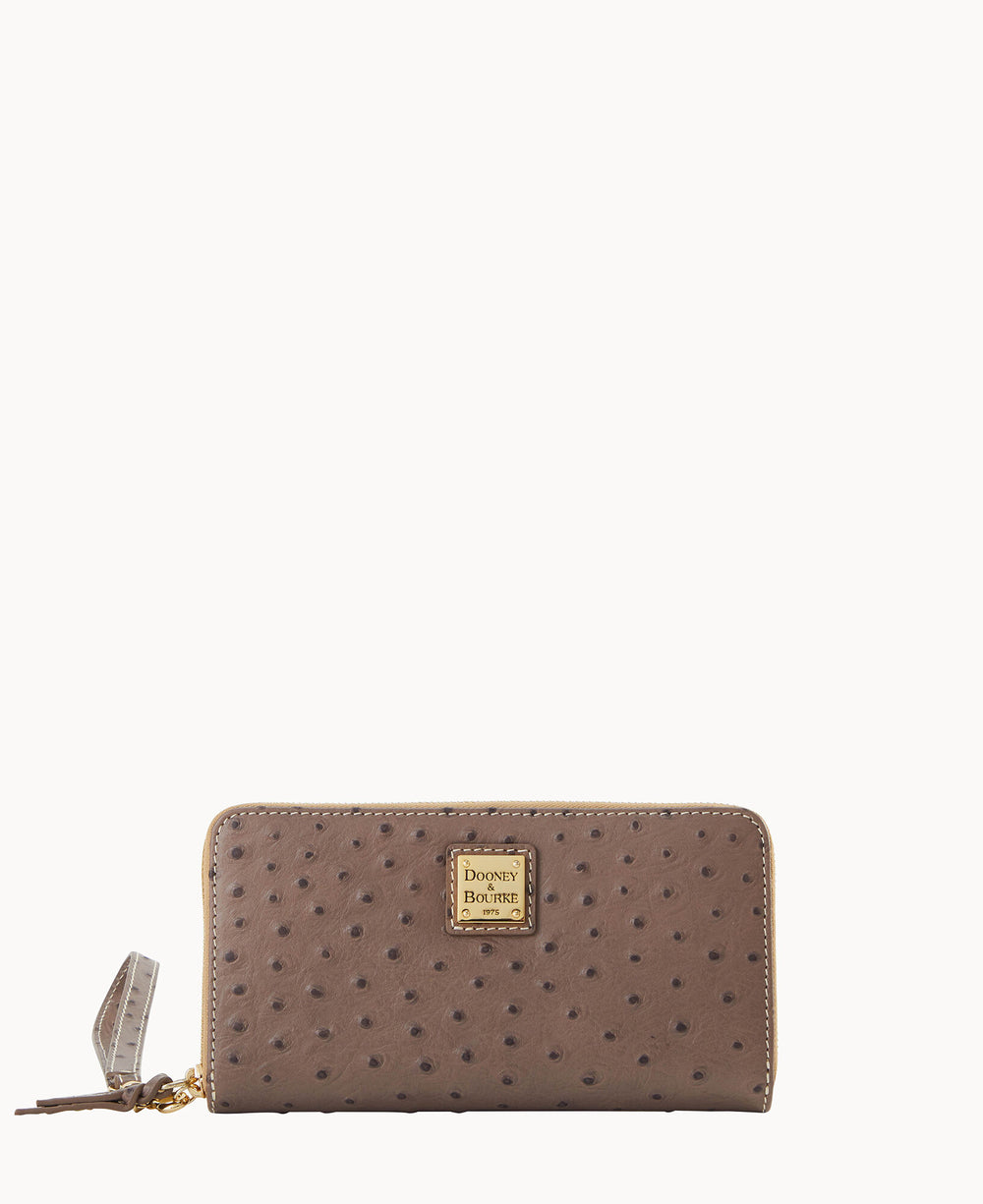 A brown Dooney & Bourke wallet with an ostrich texture, gold zipper, matching pull tab, and a gold brand logo plate on the front, displayed against a plain white background.