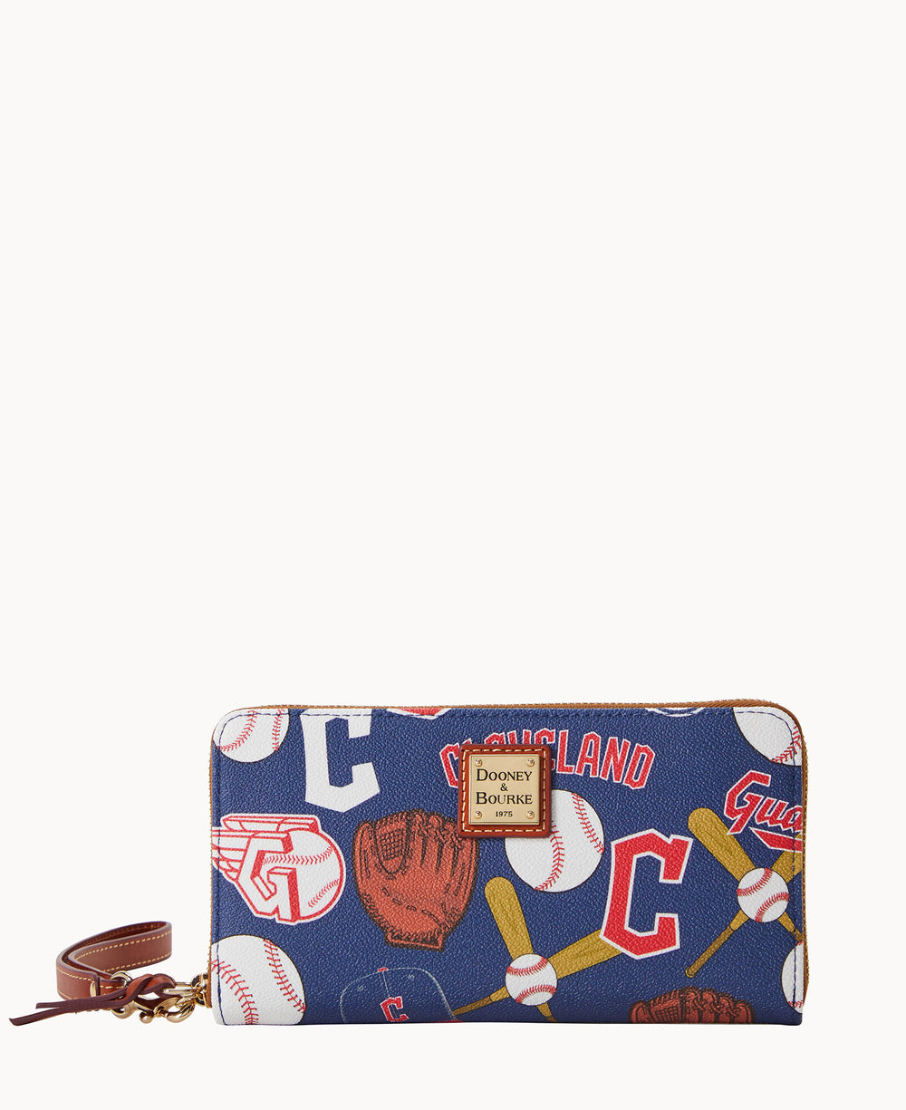 A zippered wallet with a wrist strap featuring a baseball-themed design, including gloves, bats, balls, and Cleveland text on a blue background. The Dooney & Bourke logo is displayed on the front.