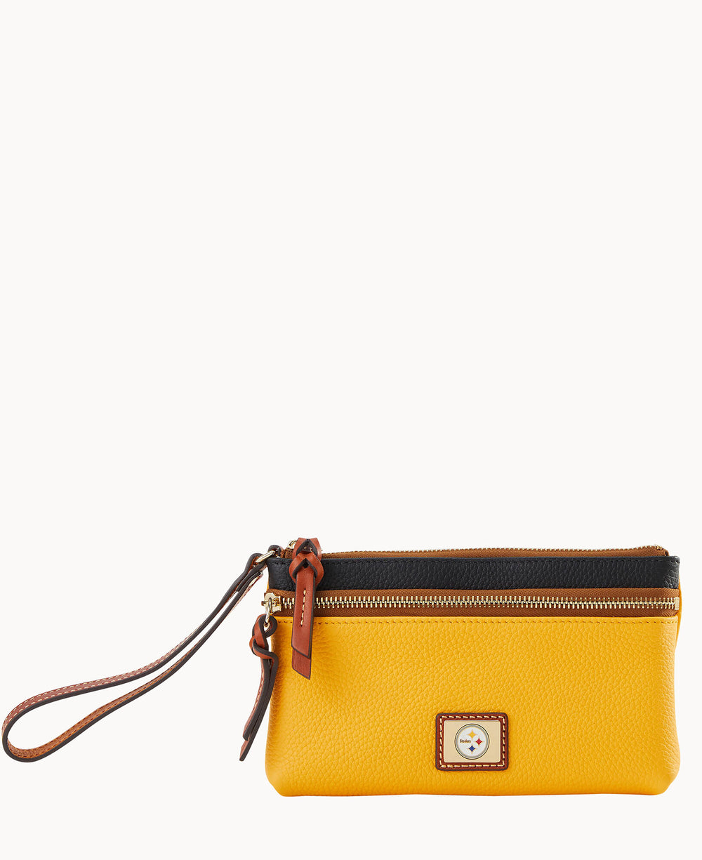 A small yellow wristlet pouch with a brown strap, gold zipper, black trim, and a rectangular logo patch featuring a star symbol on the front.