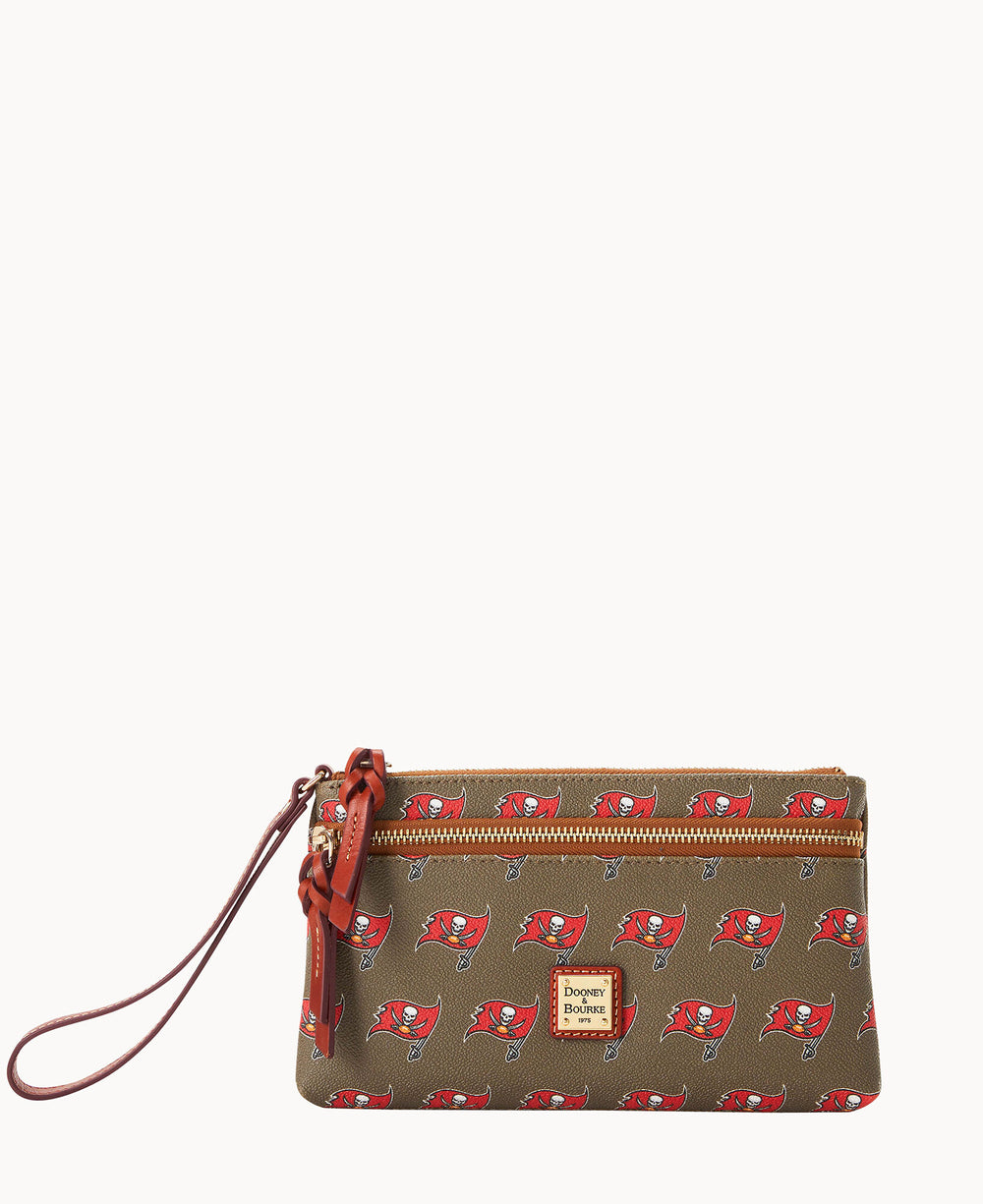 A brown wristlet clutch with a red Tampa Bay Buccaneers football team logo pattern, gold zipper, and a brown leather wrist strap. The front features a gold Dooney & Bourke logo plate.