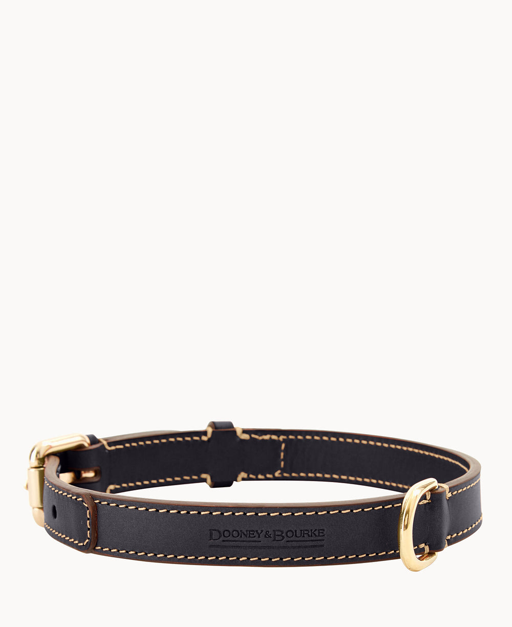 A dark leather Dooney & Bourke dog collar with gold-tone metal buckle and hardware, featuring light stitching along the edges and embossed brand logo on the front.