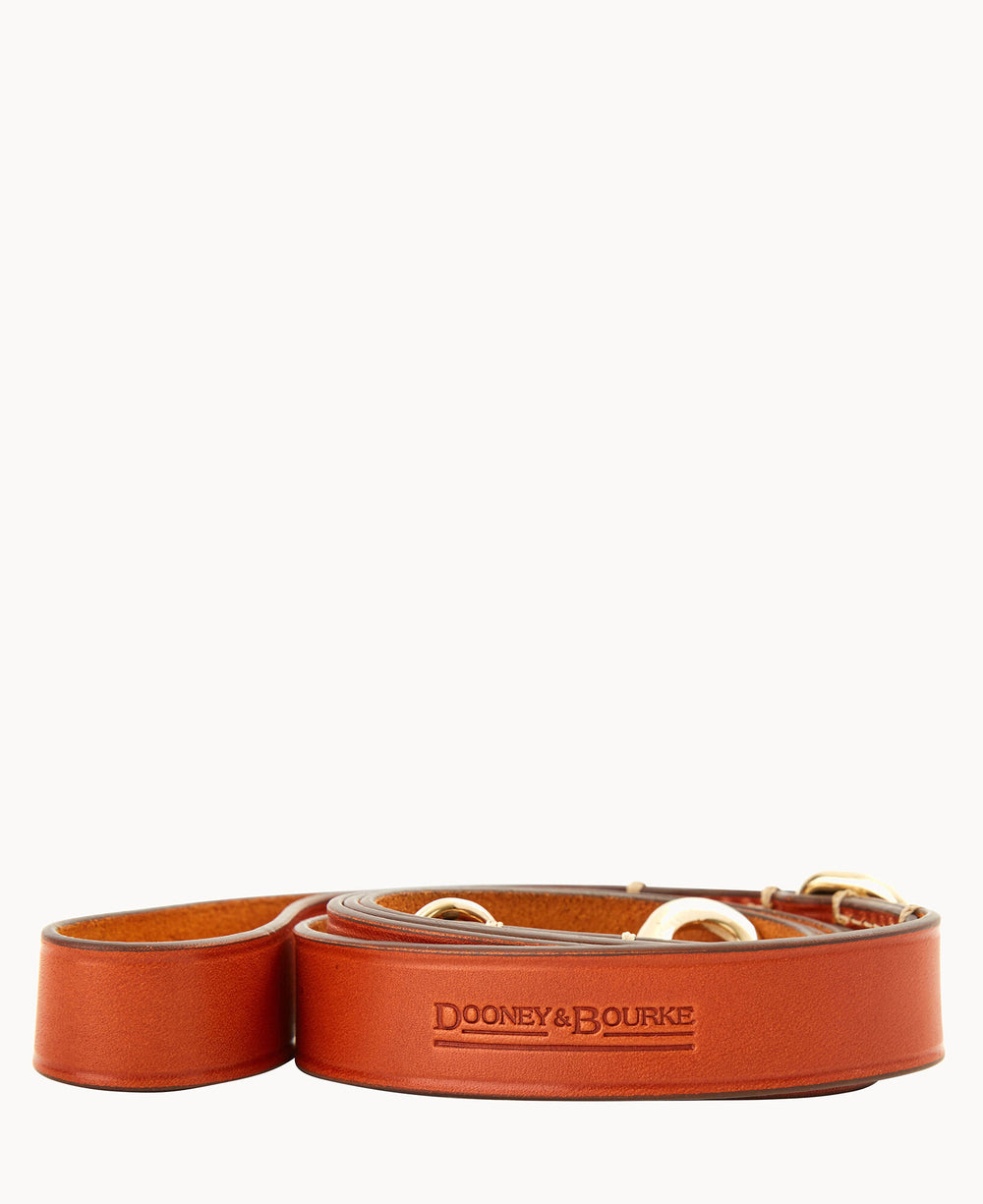A brown leather Dooney & Bourke bag strap with gold-tone hardware, coiled in a loop on a plain white background. The brand name is embossed on the visible section of the strap.