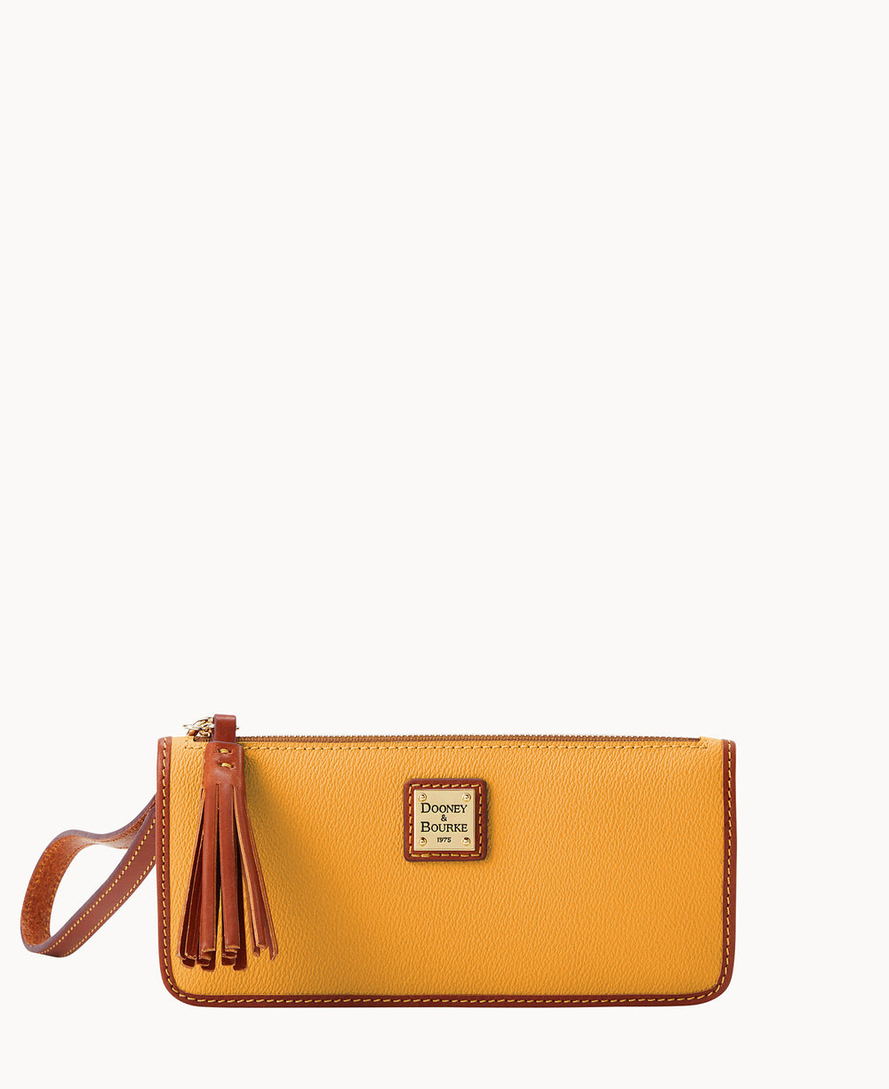A yellow leather wristlet purse with a brown strap, tassel zipper pull, and a metal Dooney & Bourke logo plate on the front.