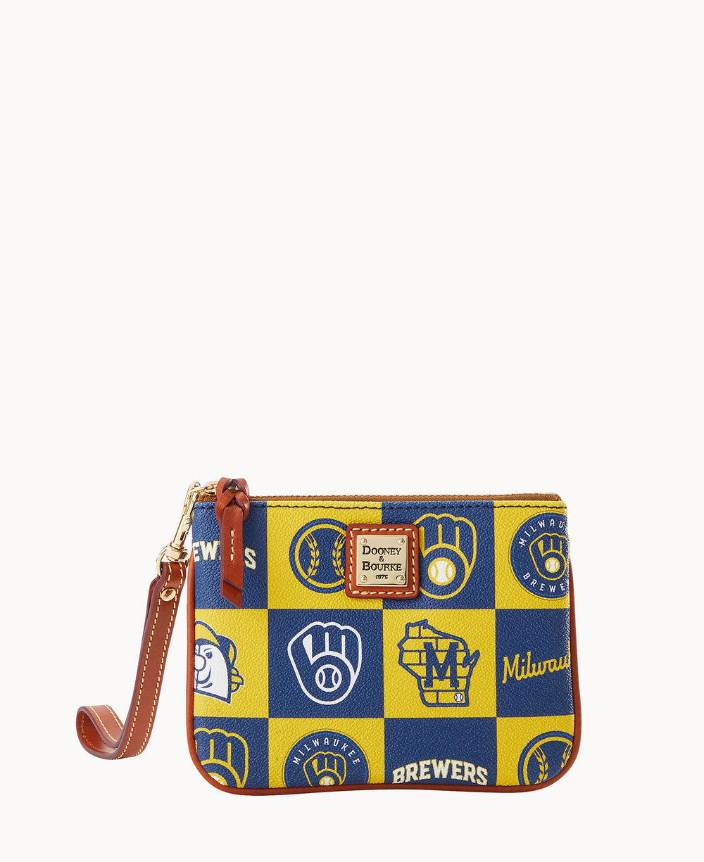 A small wristlet with a checkered blue and yellow pattern featuring Milwaukee Brewers logos and text, brown leather trim, and a Dooney & Bourke label on the front.