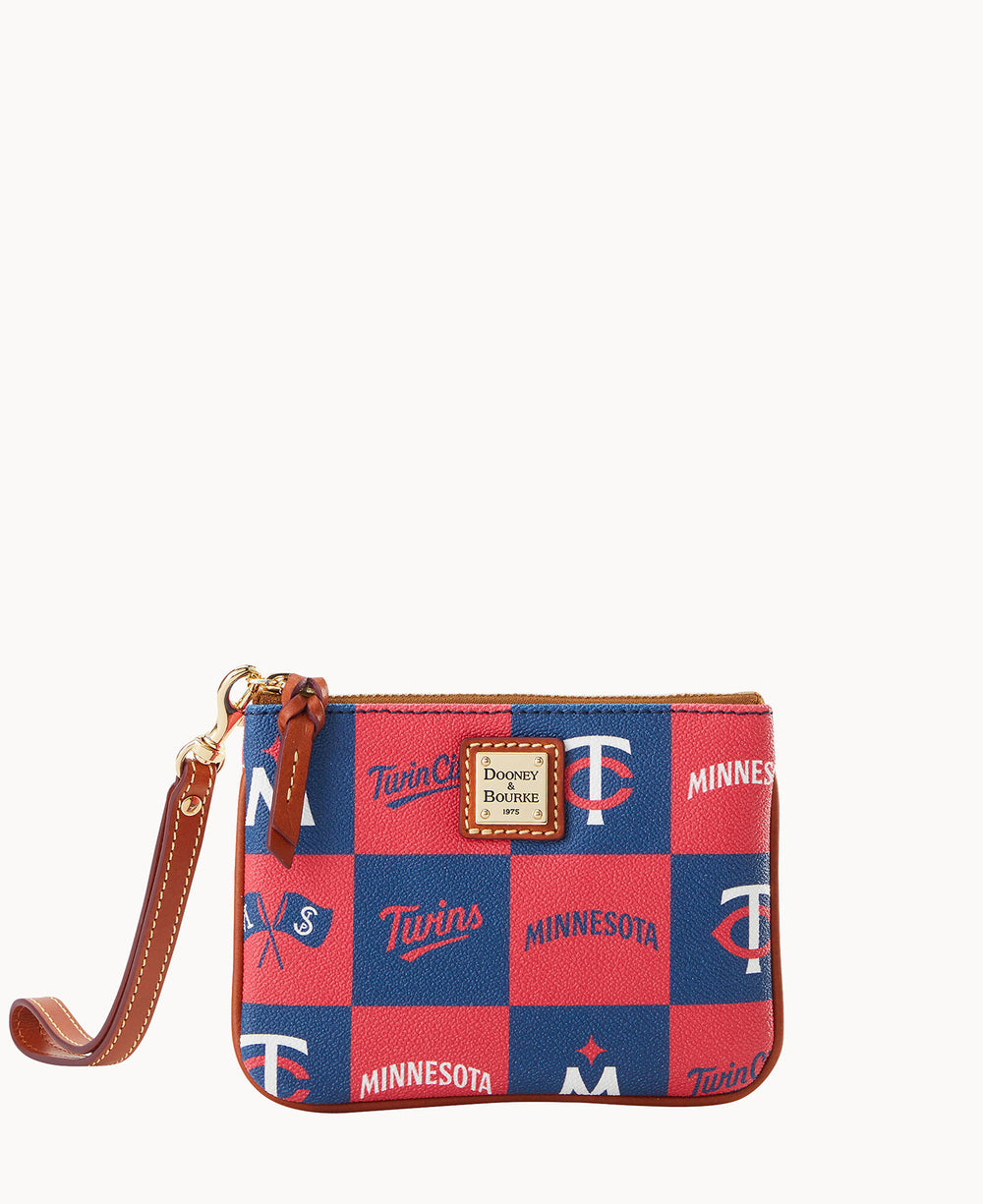 A small wristlet pouch with brown leather trim and a red-and-blue checkered pattern featuring Minnesota Twins and Dooney & Bourke logos, along with â€œMinnesotaâ€ text. The pouch has a detachable wrist strap.