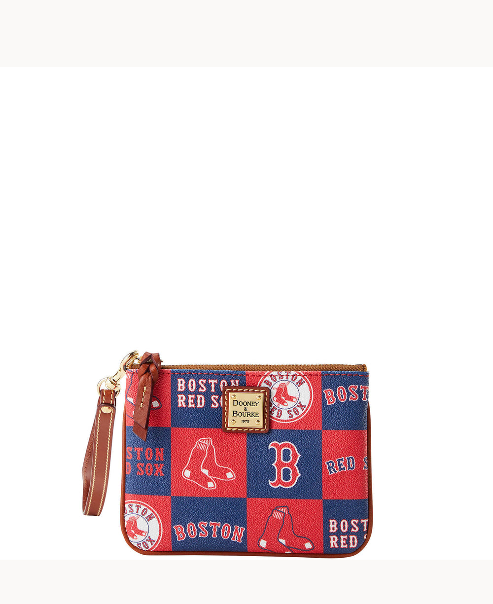 A small wristlet pouch with a brown strap, featuring a red and blue Boston Red Sox patchwork design and a Dooney & Bourke logo plate on the front.