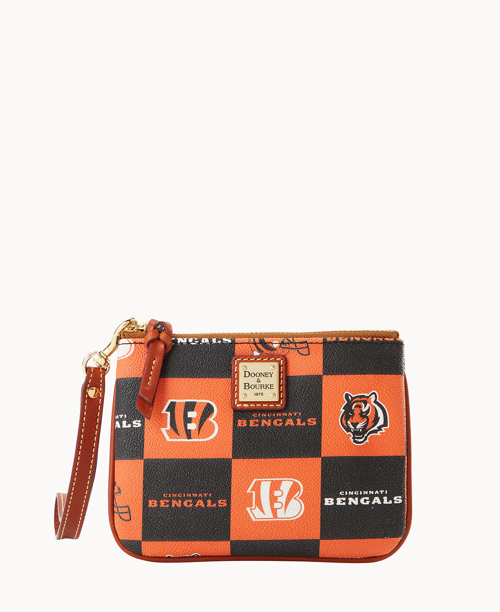 Small wristlet purse with a checkered orange and black pattern featuring Cincinnati Bengals logos, a tiger head, and the brand label Dooney & Bourke on the front, with a brown leather strap.