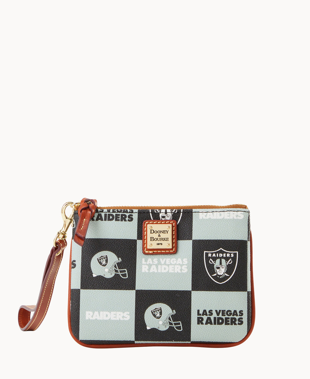 A small wristlet pouch with a Las Vegas Raiders black and gray checkered design, featuring Raiders logos and helmets. It has a brown leather strap and trim, and a Dooney & Bourke label on the front.