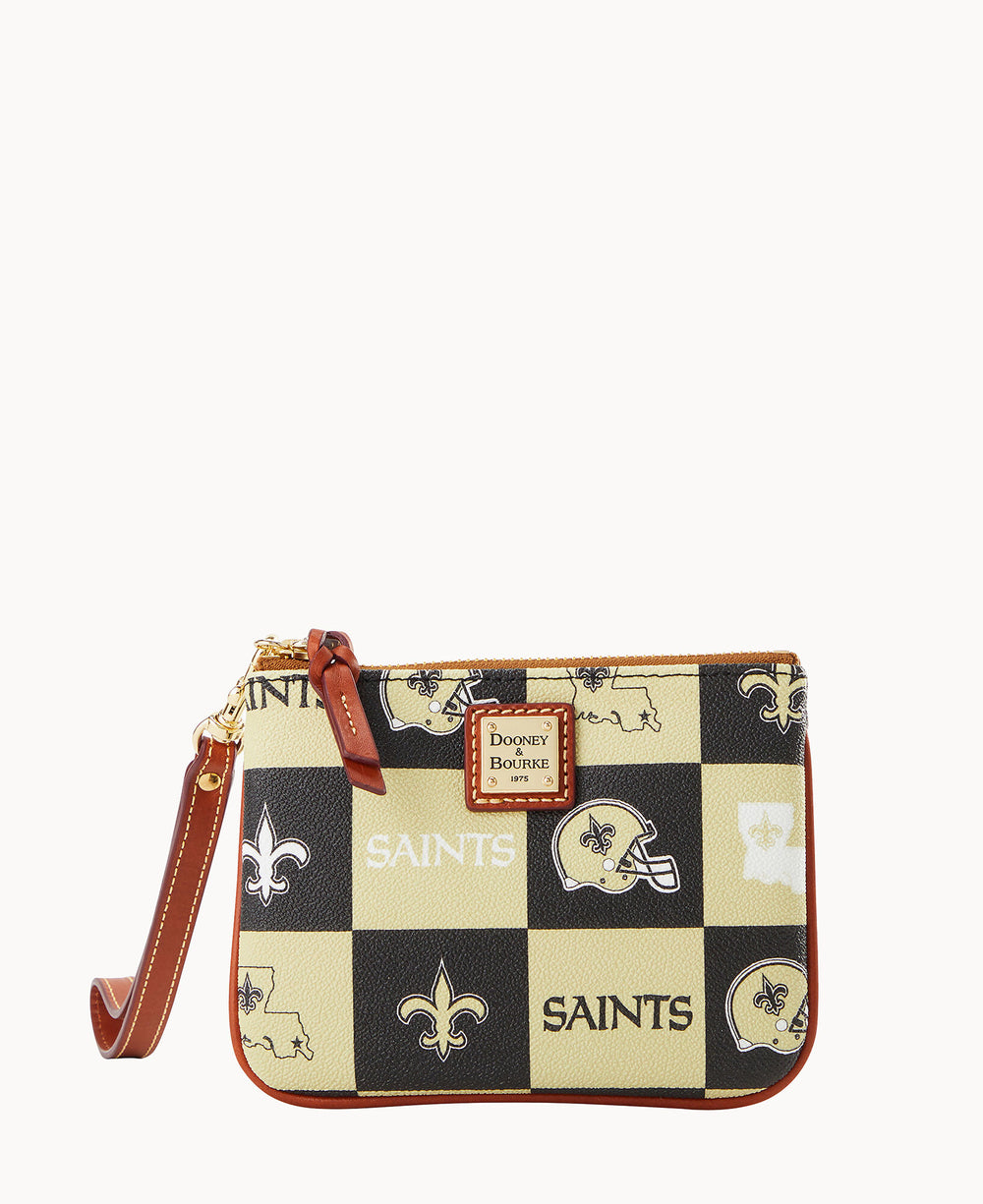 A small wristlet pouch with a brown leather strap, featuring a black and gold checkerboard pattern with SAINTS, fleur-de-lis symbols, football helmets, and Louisiana state outlines. â€œDooney & Bourkeâ€ logo on front.