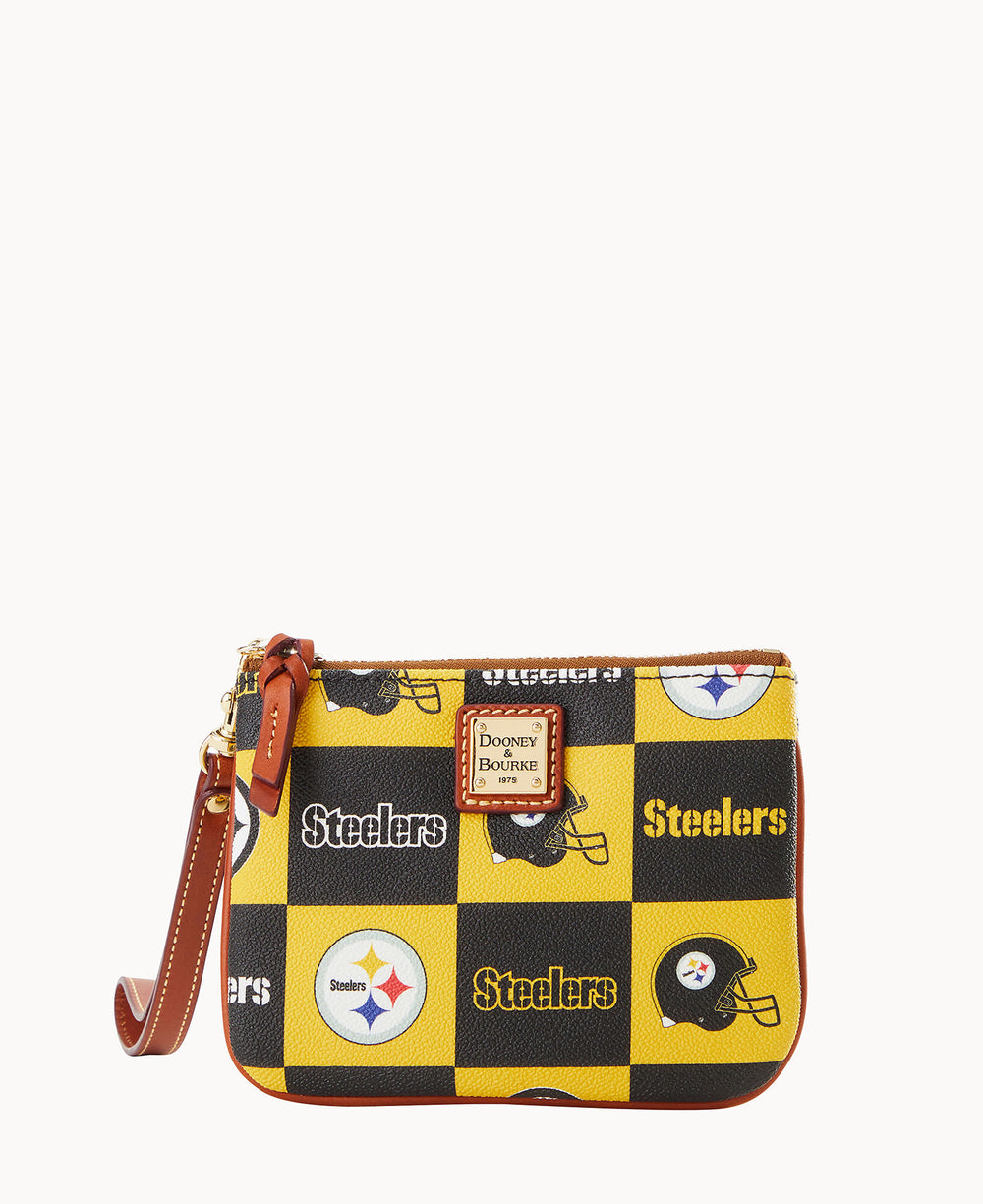 A small wristlet with a brown leather strap, featuring a black and yellow checkerboard pattern with Pittsburgh Steelers logos, football helmets, and the word Steelers. The bag has a Dooney & Bourke label on the front.