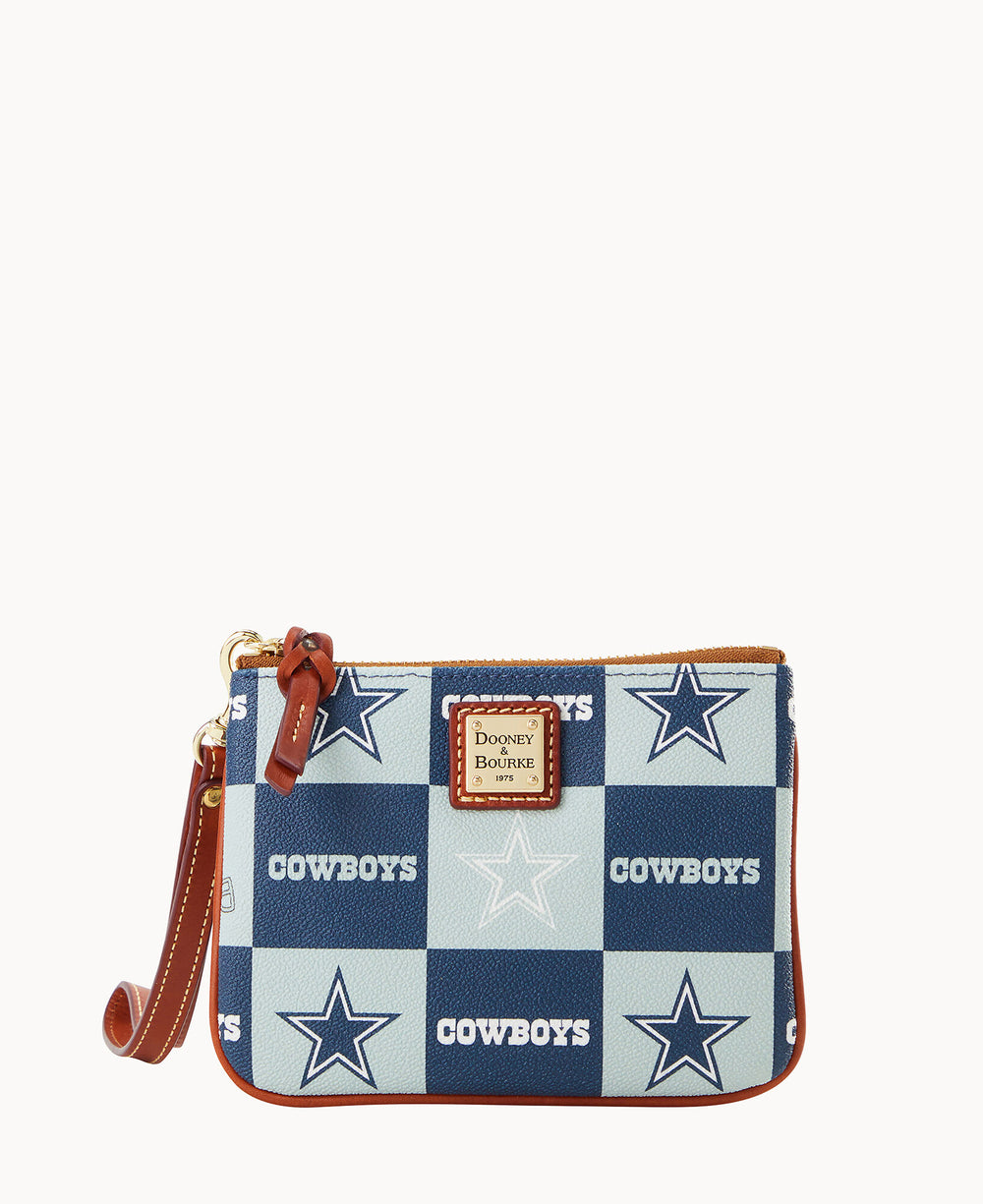 A small wristlet purse with a blue and white checkerboard pattern, featuring stars and the word COWBOYS. It has brown trim, a Dooney & Bourke logo patch, and a brown wrist strap.